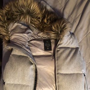 Winter vest with faux fur hood